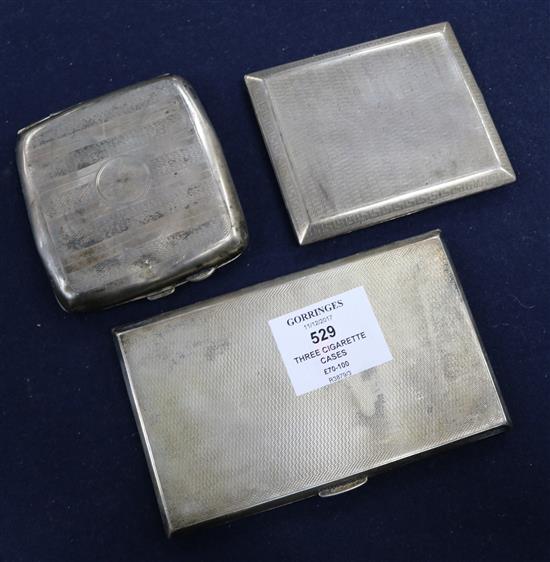 Three silver cigarette cases.